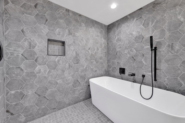 9700 N Helene Cv, Millington, TN 38053 - full bath featuring tile walls, a freestanding tub, tile patterned flooring, and recessed lighting