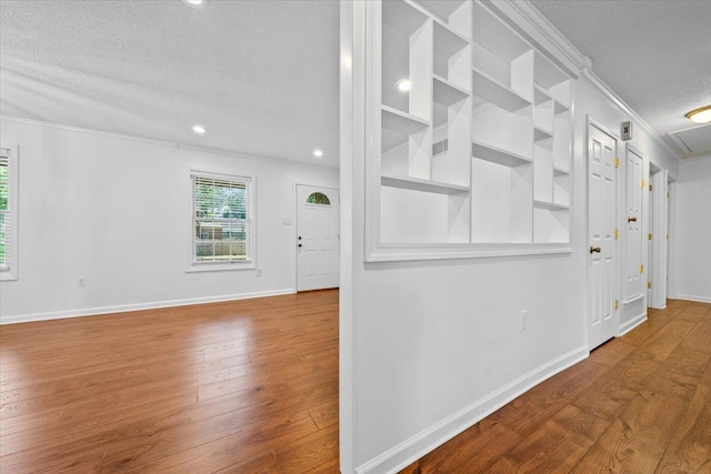 6864 Aspenhill Dr, Bartlett, TN 38135 - corridor with crown molding, a textured ceiling, wood finished floors, and recessed lighting