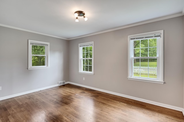3218 Joffre Ave, Memphis, TN 38111 - spare room with plenty of natural light, wood finished floors, and ornamental molding