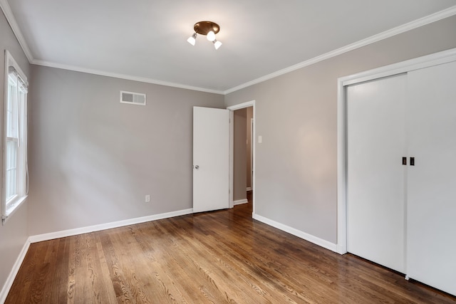 3218 Joffre Ave, Memphis, TN 38111 - unfurnished bedroom featuring wood finished floors, ornamental molding, and a closet