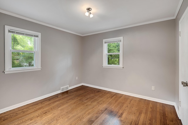 3218 Joffre Ave, Memphis, TN 38111 - empty room with healthy amount of natural light, wood finished floors, and crown molding