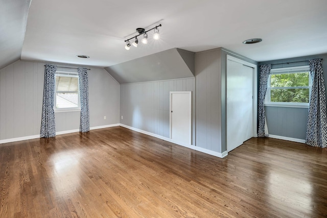 3218 Joffre Ave, Memphis, TN 38111 - additional living space with healthy amount of natural light, vaulted ceiling, wood finished floors, and wood walls