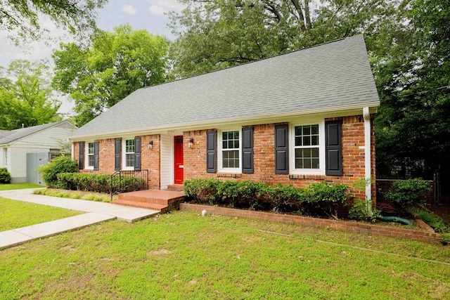 3218 Joffre Ave, Memphis, TN 38111 - view of front of home with roof with shingles, a front lawn, and brick siding