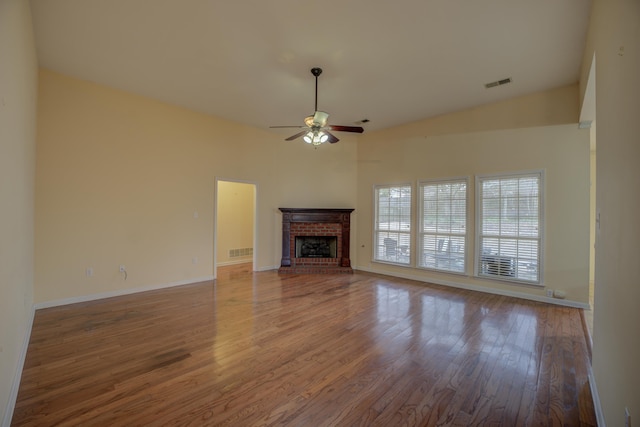 6384 Acree Woods Dr, Olive Branch, MS 38654 - unfurnished living room with ceiling fan, wood finished floors, a fireplace, and vaulted ceiling