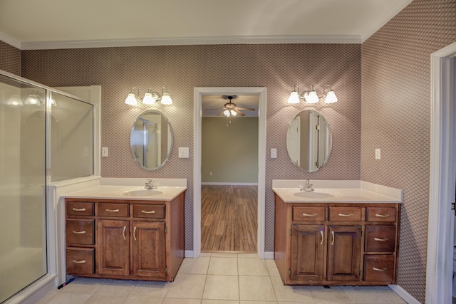 6384 Acree Woods Dr, Olive Branch, MS 38654 - bathroom with ornamental molding, ceiling fan, two vanities, a shower stall, and tile patterned flooring