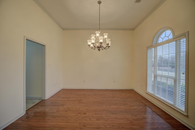 6384 Acree Woods Dr, Olive Branch, MS 38654 - spare room featuring a chandelier, wood finished floors, and ornamental molding