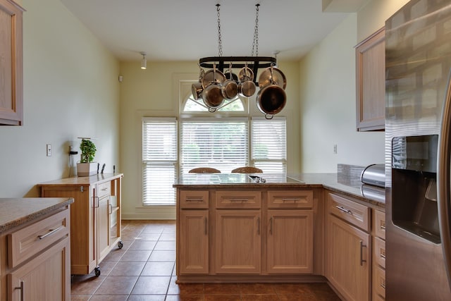 1501 Granville Ln, Memphis, TN 38104 - kitchen featuring stainless steel fridge with ice dispenser, a peninsula, tile patterned flooring, a chandelier, and black electric stovetop