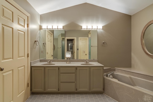 1501 Granville Ln, Memphis, TN 38104 - full bathroom with vaulted ceiling, double vanity, and a bath