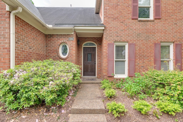 1501 Granville Ln, Memphis, TN 38104 - doorway to property featuring brick siding and a shingled roof