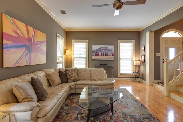 1501 Granville Ln, Memphis, TN 38104 - living area featuring ceiling fan, wood finished floors, stairway, and crown molding