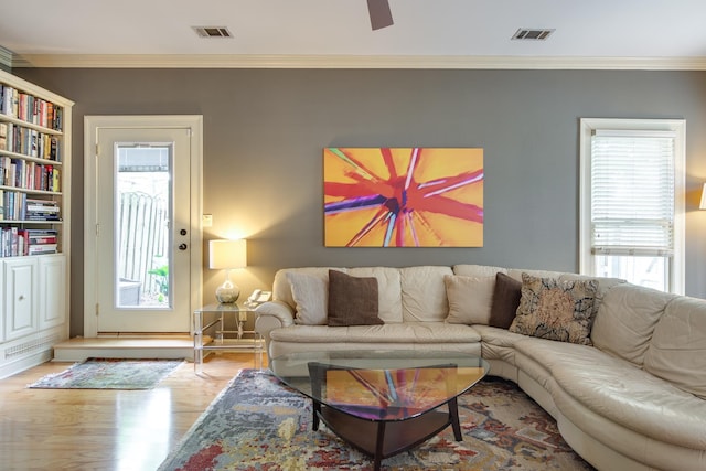 1501 Granville Ln, Memphis, TN 38104 - living area featuring healthy amount of natural light, wood finished floors, crown molding, and ceiling fan