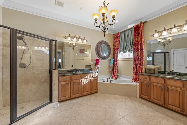 11095 Latting Rd, Eads, TN 38028 - bathroom with a chandelier, ornamental molding, a bath, two vanities, and a shower stall