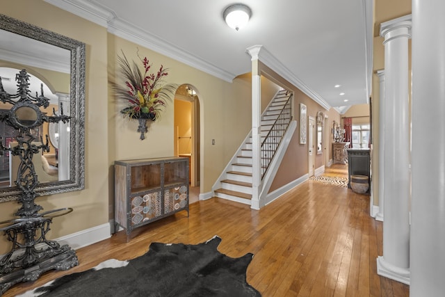 11095 Latting Rd, Eads, TN 38028 - entrance foyer with ornate columns, crown molding, hardwood / wood-style flooring, stairs, and arched walkways