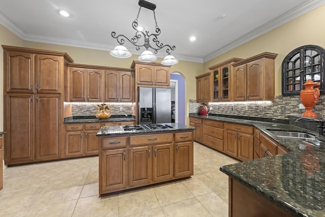 11095 Latting Rd, Eads, TN 38028 - kitchen featuring stainless steel fridge with ice dispenser, arched walkways, backsplash, gas cooktop, and crown molding
