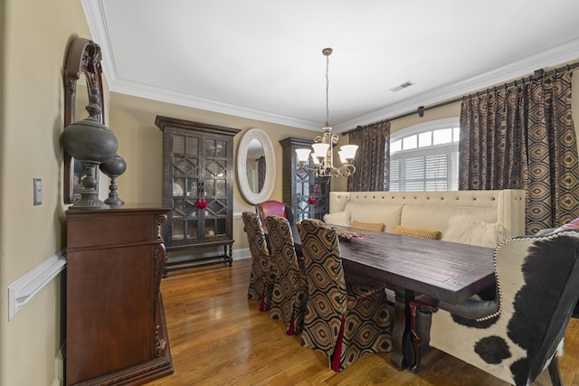 11095 Latting Rd, Eads, TN 38028 - dining space with a chandelier, crown molding, wood finished floors, and breakfast area