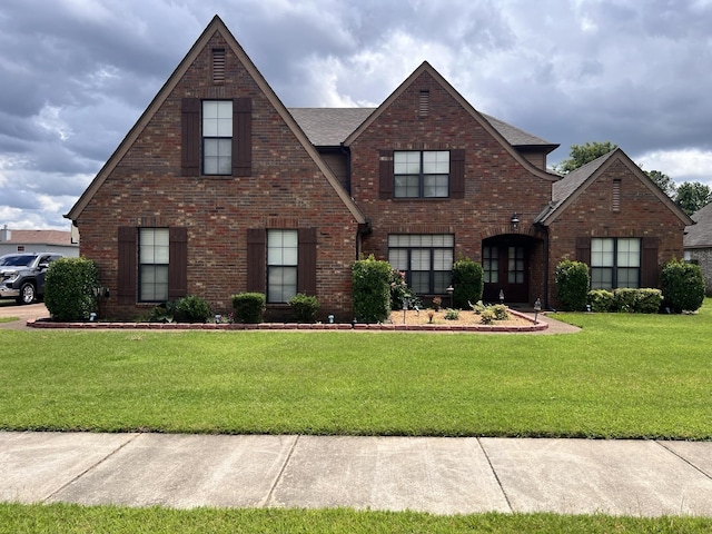 5094 Foggy River Ln, Bartlett, TN 38135 - view of front of property with brick siding, a front yard, and roof with shingles
