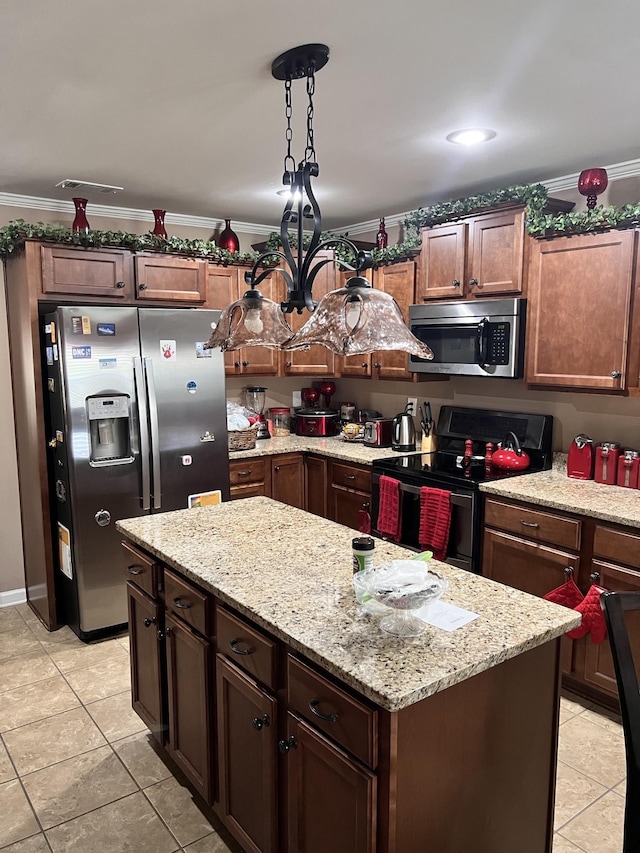 5094 Foggy River Ln, Bartlett, TN 38135 - kitchen featuring stainless steel appliances, light tile patterned flooring, a center island, light stone countertops, and crown molding