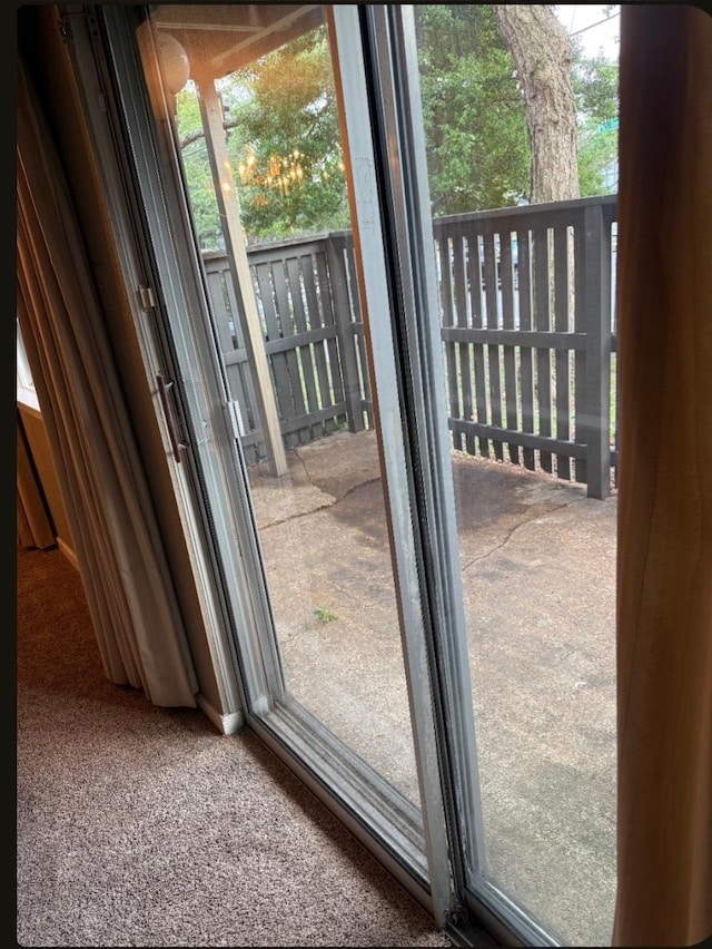 4779 Towering Oaks Dr Unit 704, Memphis, TN 38117 - doorway with healthy amount of natural light and carpet flooring