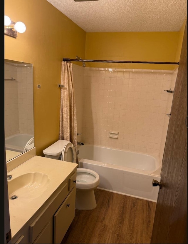 4779 Towering Oaks Dr Unit 704, Memphis, TN 38117 - full bath featuring wood finished floors, a textured ceiling, shower / bathtub combination, and vanity
