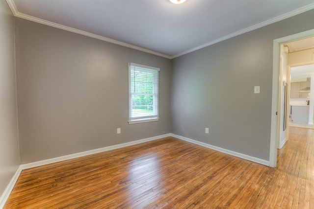 4427 Quince Rd, Memphis, TN 38117 - empty room featuring attic access, hardwood / wood-style flooring, and crown molding