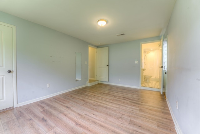 4427 Quince Rd, Memphis, TN 38117 - unfurnished bedroom featuring light wood-style flooring and ensuite bath