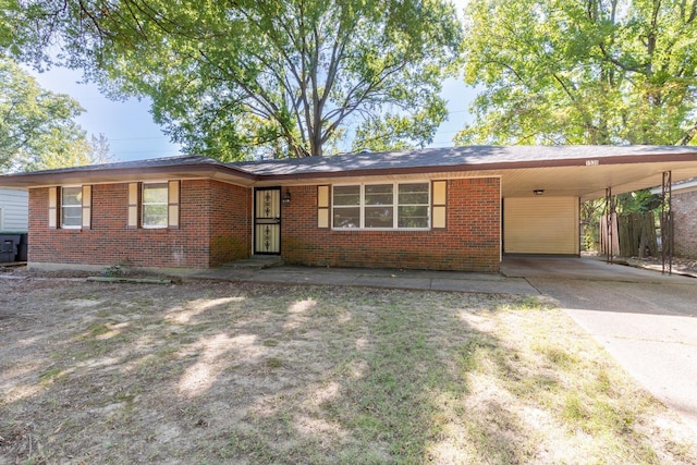 1539 Eason Ave, Memphis, TN 38116 - ranch-style house with brick siding, an attached carport, and driveway