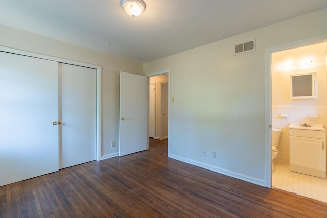 1539 Eason Ave, Memphis, TN 38116 - unfurnished bedroom with wood finished floors, a closet, and ensuite bath