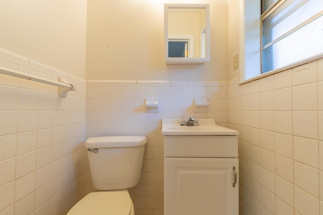 1539 Eason Ave, Memphis, TN 38116 - half bathroom with tile walls, vanity, and a wainscoted wall