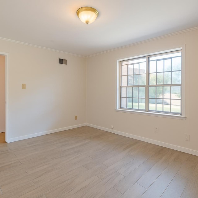 1539 Eason Ave, Memphis, TN 38116 - unfurnished room featuring light wood-type flooring and crown molding