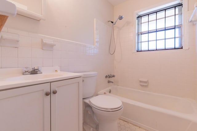 1539 Eason Ave, Memphis, TN 38116 - full bath with shower / bathtub combination, vanity, tile walls, tile patterned flooring, and a wainscoted wall