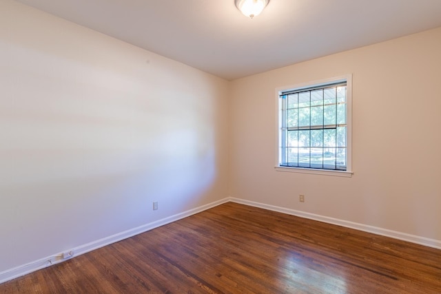 1539 Eason Ave, Memphis, TN 38116 - spare room with dark wood-type flooring and baseboards