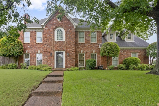 1231 Pinnacle Point Dr, Collierville, TN 38017 - colonial home featuring a front yard, brick siding, and a shingled roof