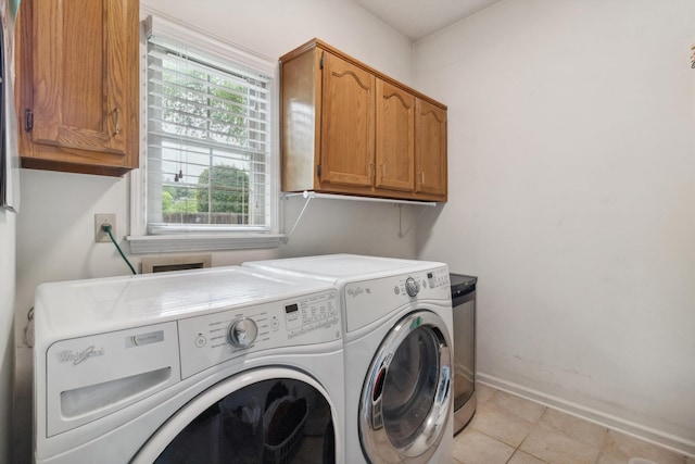 1231 Pinnacle Point Dr, Collierville, TN 38017 - laundry room with cabinet space, washing machine and dryer, and light tile patterned flooring