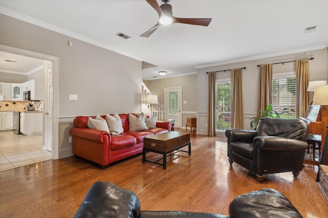 1231 Pinnacle Point Dr, Collierville, TN 38017 - living room with ceiling fan, light wood-style floors, and crown molding