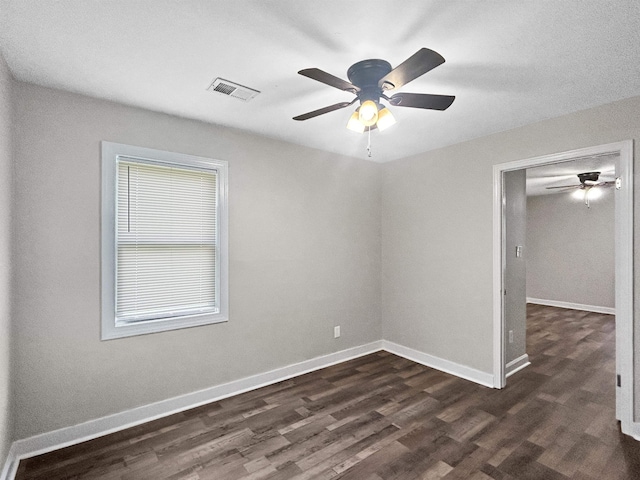 1644 N Graham St, Memphis, TN 38108 - empty room featuring a ceiling fan and dark wood-style floors