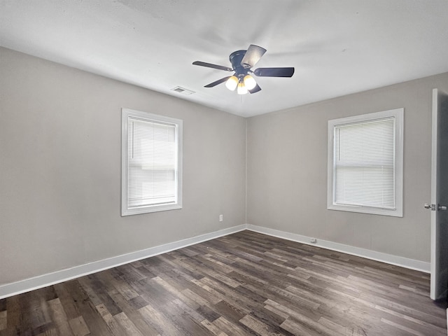 1644 N Graham St, Memphis, TN 38108 - empty room with dark wood-type flooring and ceiling fan