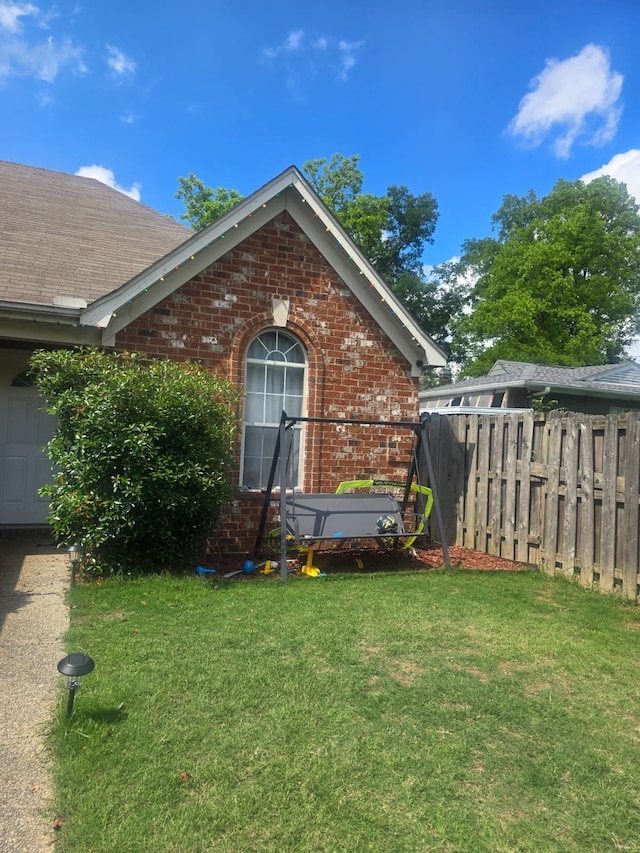 4568 Perkins Grove Cv, Memphis, TN 38122 - view of side of property with brick siding and roof with shingles