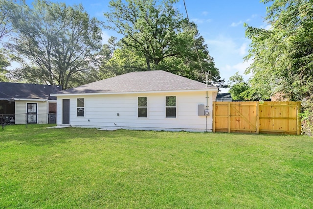 4130 Cottonwood Rd, Memphis, TN 38118 - back of property with a gate and roof with shingles