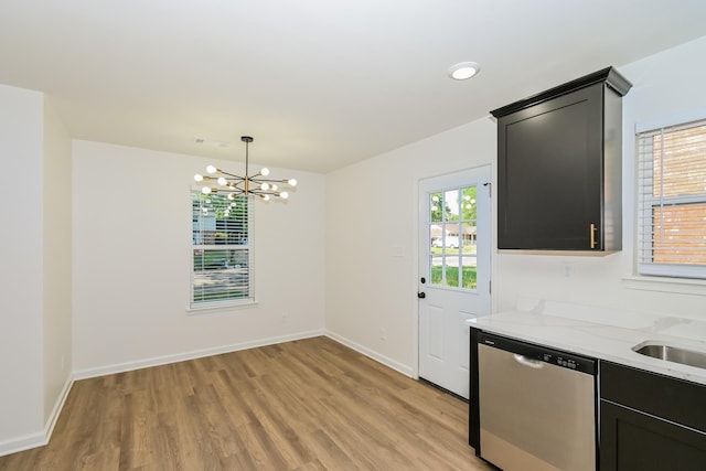 4130 Cottonwood Rd, Memphis, TN 38118 - unfurnished dining area with light wood-type flooring and a chandelier
