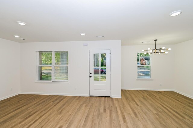 4130 Cottonwood Rd, Memphis, TN 38118 - entrance foyer featuring healthy amount of natural light, light wood-style flooring, a chandelier, and recessed lighting