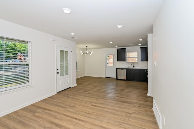 4130 Cottonwood Rd, Memphis, TN 38118 - unfurnished living room featuring a chandelier, light wood-type flooring, and recessed lighting
