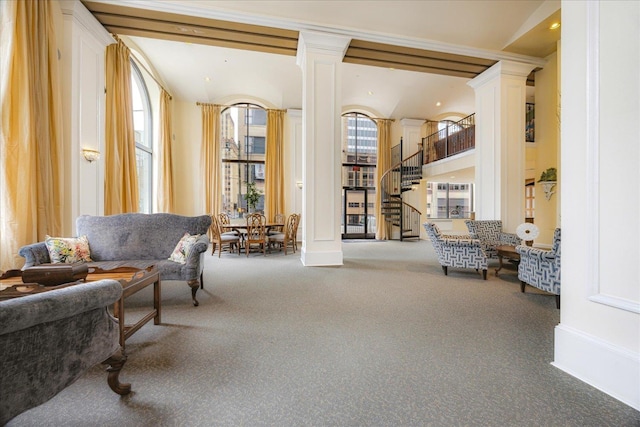 127 Madison Ave Unit 602, Memphis, TN 38103 - sitting room featuring carpet flooring, ornate columns, and stairway