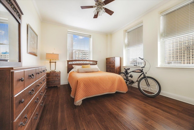 127 Madison Ave Unit 602, Memphis, TN 38103 - bedroom with dark wood-style floors, ornamental molding, and a ceiling fan