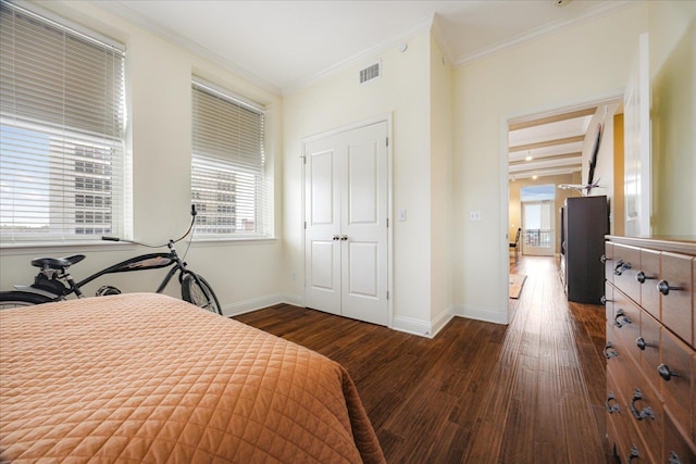 127 Madison Ave Unit 602, Memphis, TN 38103 - bedroom featuring multiple windows, dark wood-style flooring, and crown molding