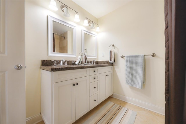 127 Madison Ave Unit 602, Memphis, TN 38103 - bathroom with double vanity and baseboards