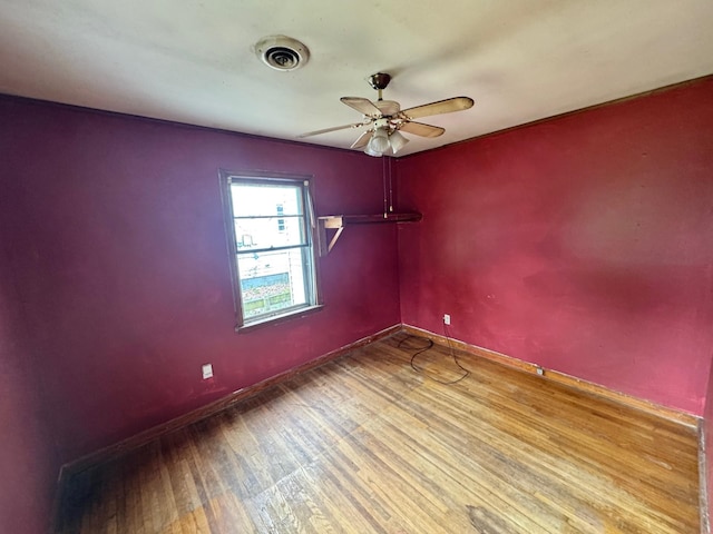 1445 Depass St, Memphis, TN 38122 - unfurnished room featuring wood finished floors and a ceiling fan