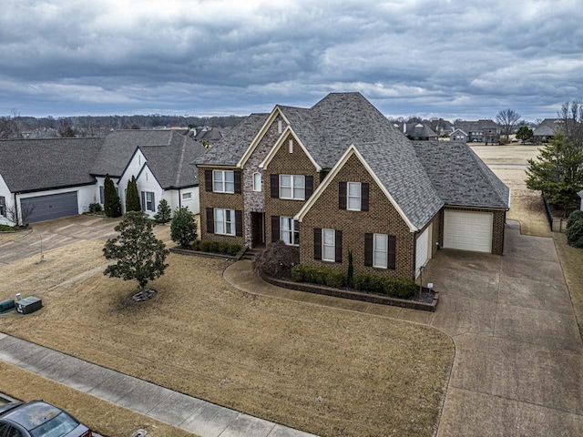 190 Links View Dr, Oakland, TN 38060 - view of front facade featuring concrete driveway, brick siding, a residential view, and an attached garage