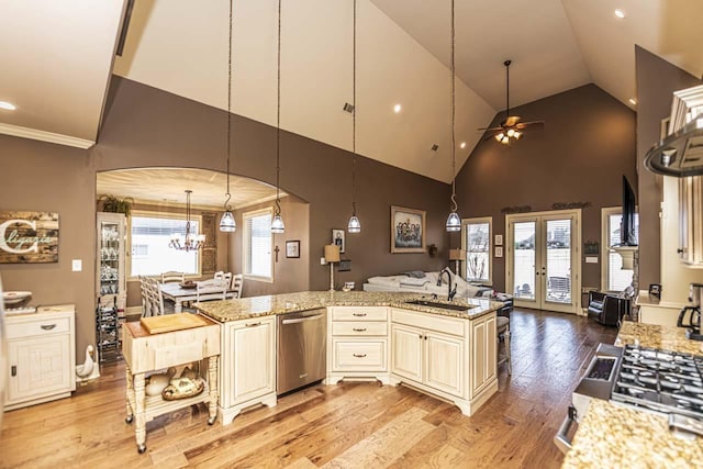 190 Links View Dr, Oakland, TN 38060 - kitchen featuring stainless steel dishwasher, cream cabinets, open floor plan, light wood-type flooring, and a ceiling fan