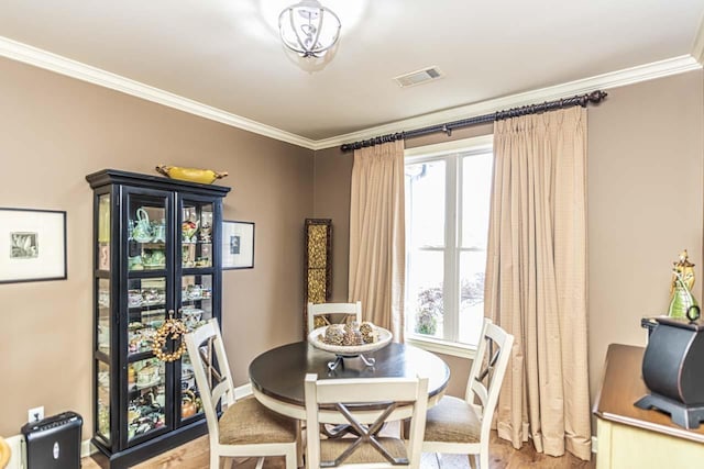 190 Links View Dr, Oakland, TN 38060 - dining area featuring light wood-style floors, ornamental molding, and plenty of natural light