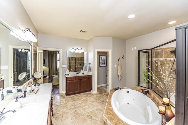 190 Links View Dr, Oakland, TN 38060 - full bathroom featuring two vanities, a jetted tub, and recessed lighting